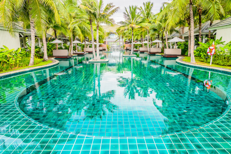 Outdoor Swimming pool in hotel resort for summer vacation backgr